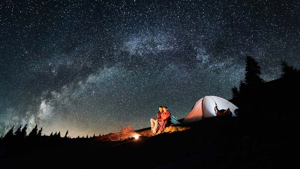 Couple under the stars camping
