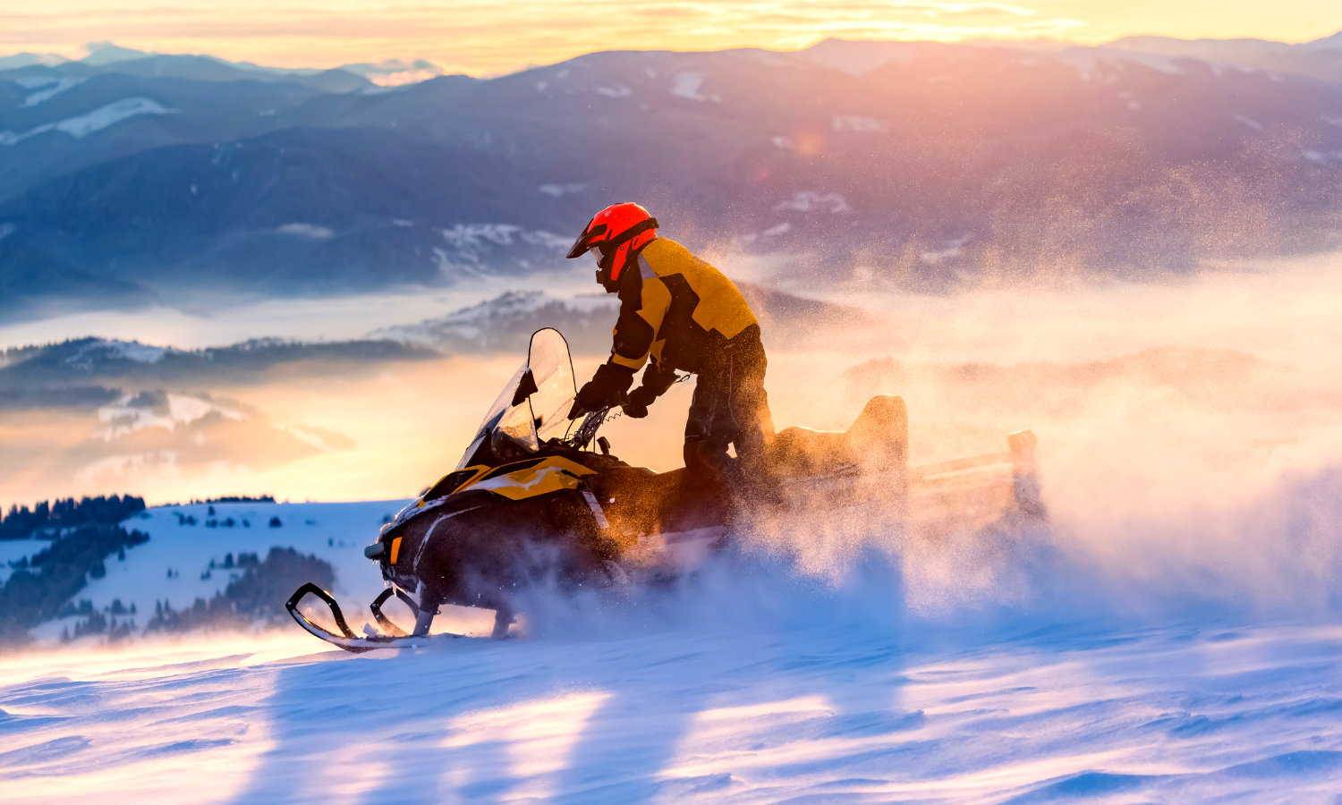 Image of man snowmobiling. 