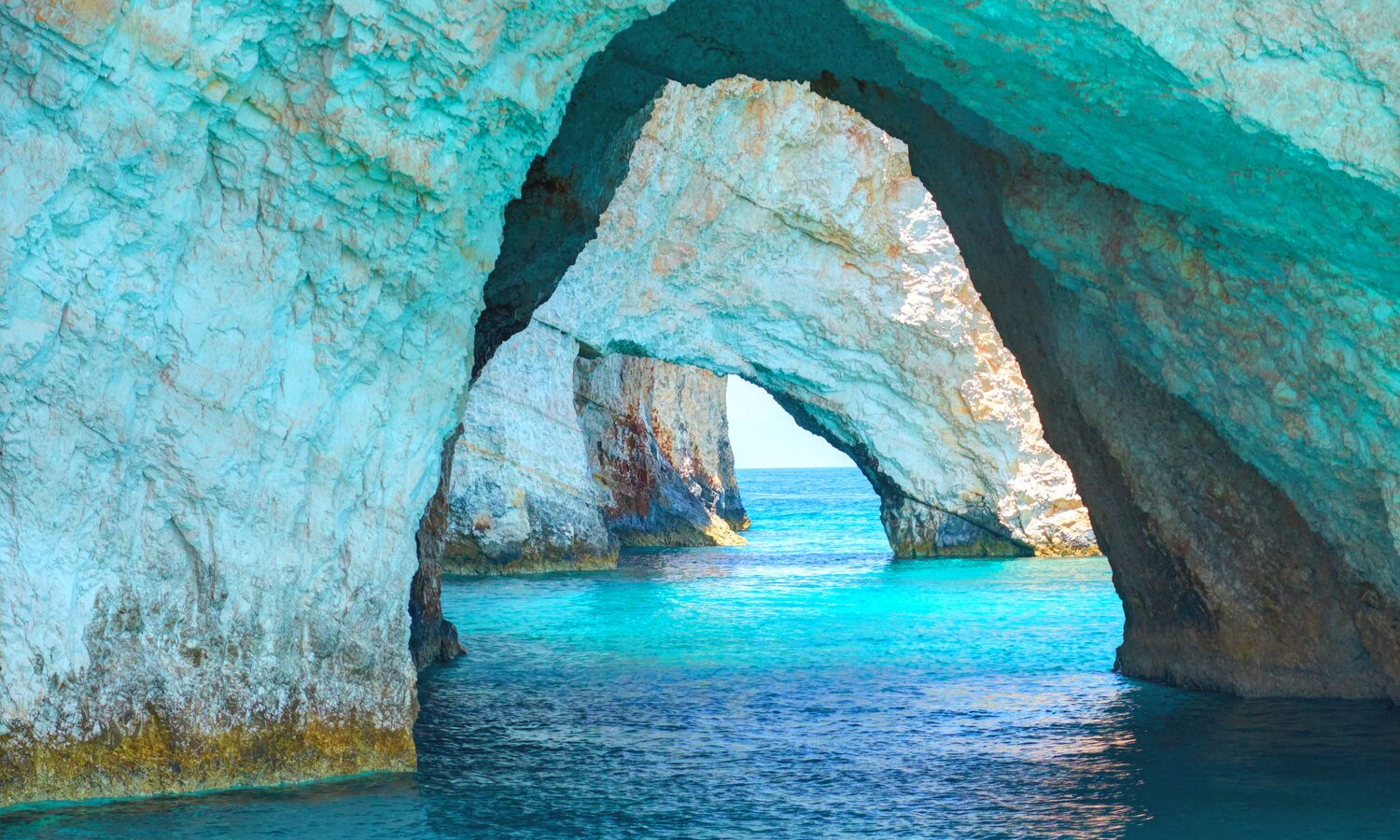 White rock arches over sea