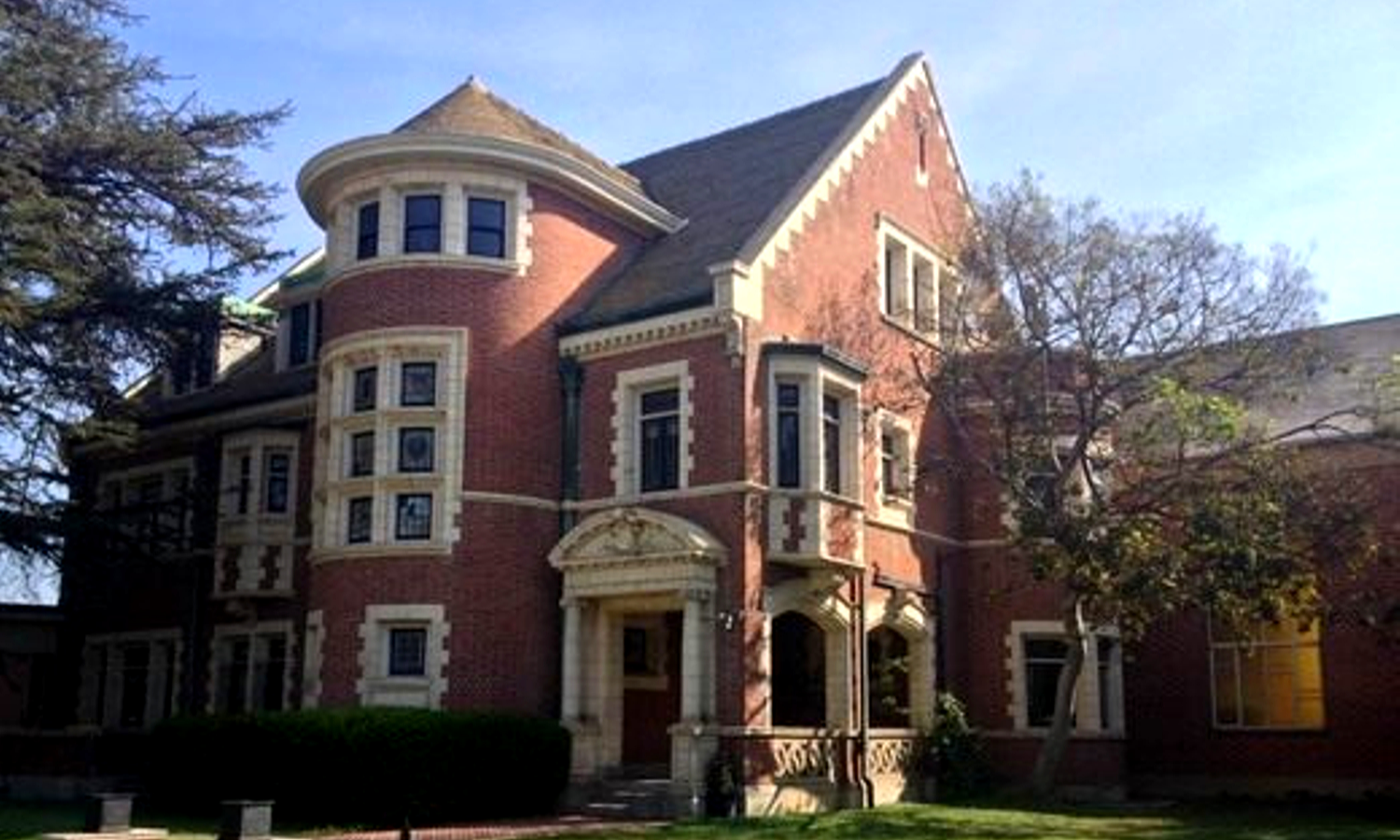 Picture of large red brick mansion. 