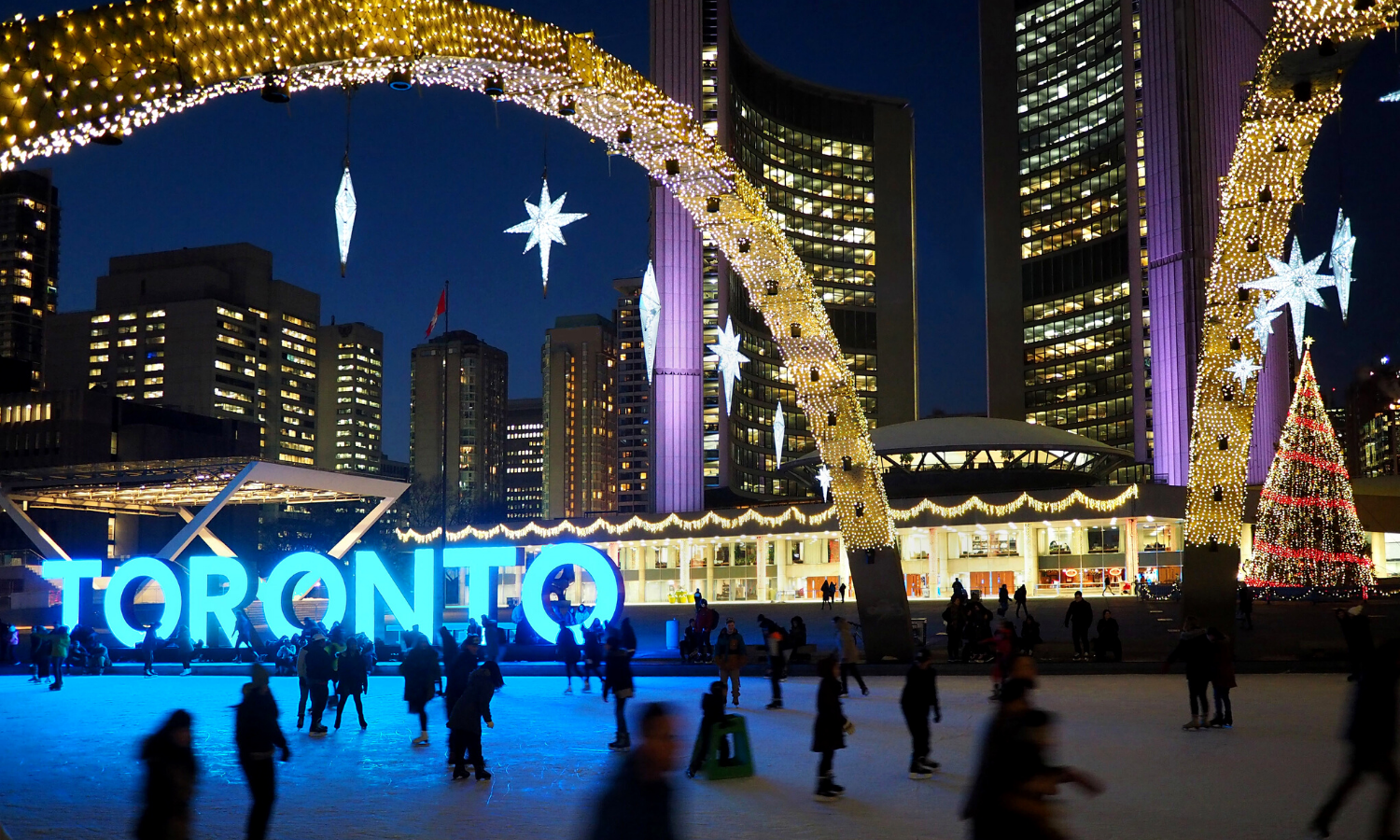 Another picture of the rink at Nathan Phillips Square. You have a better view of the modern buildings and there is a massive light up 'Toronto' sign. 